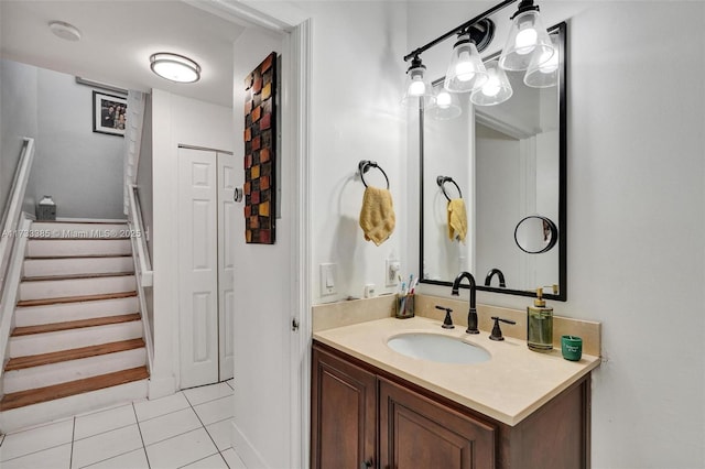 bathroom featuring tile patterned flooring, a closet, and vanity