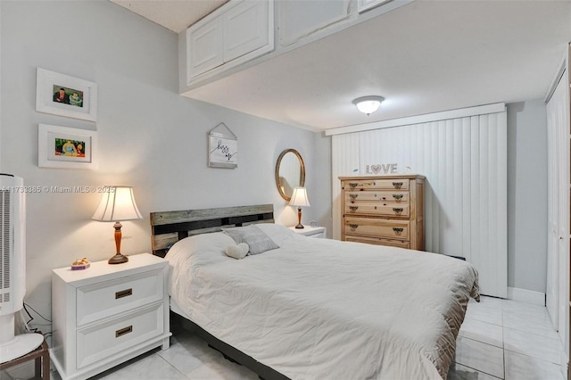 bedroom with light tile patterned flooring