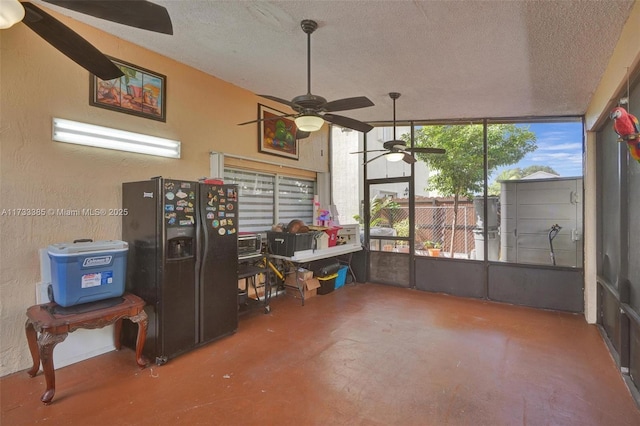 sunroom featuring ceiling fan