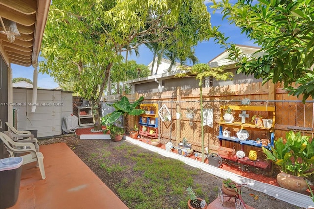 view of yard featuring a fenced backyard and a patio