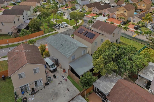 birds eye view of property with a residential view