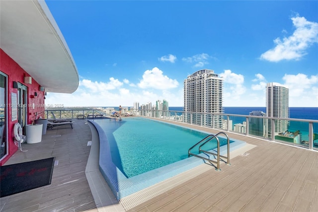 view of pool featuring a water view