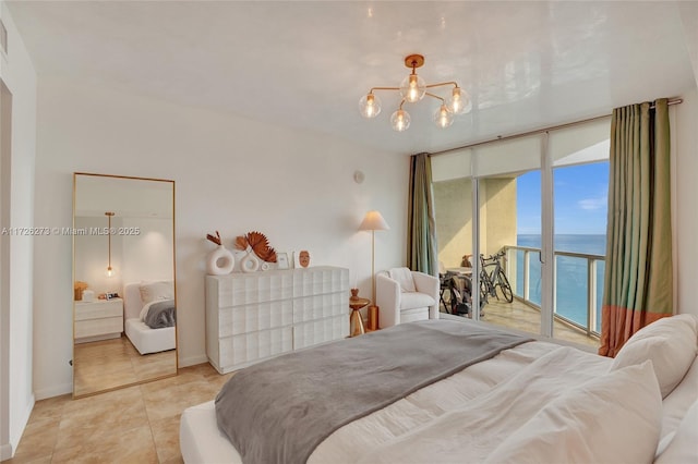 tiled bedroom with a water view, a wall of windows, access to exterior, and a chandelier