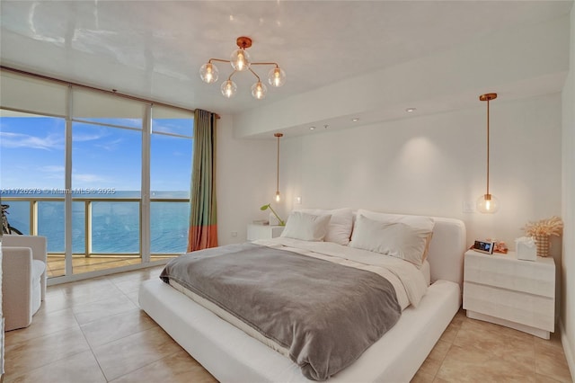 tiled bedroom featuring access to exterior, expansive windows, and a water view