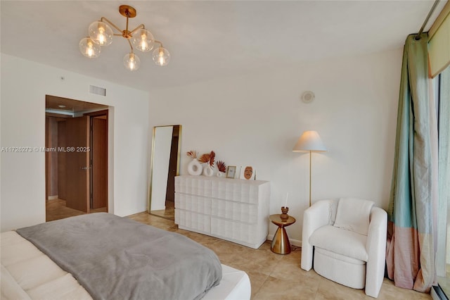 tiled bedroom featuring a chandelier