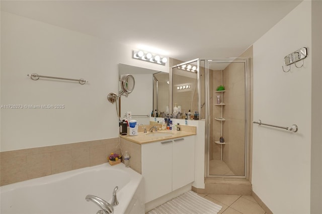 bathroom with vanity, tile patterned floors, and plus walk in shower