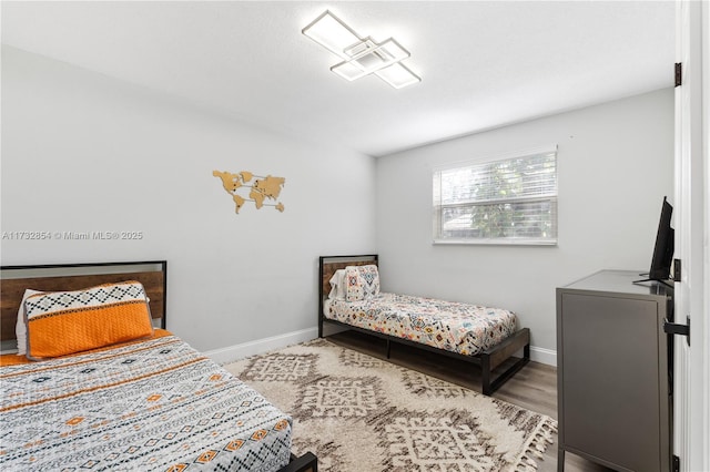 bedroom with light hardwood / wood-style floors