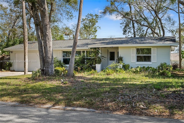 ranch-style home featuring a garage