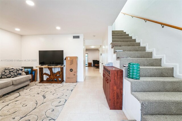 living room featuring light tile patterned floors