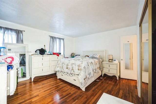 bedroom featuring dark wood-type flooring