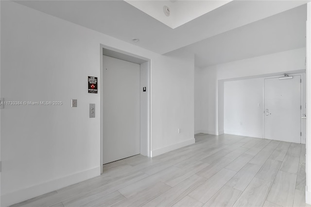 spare room with elevator