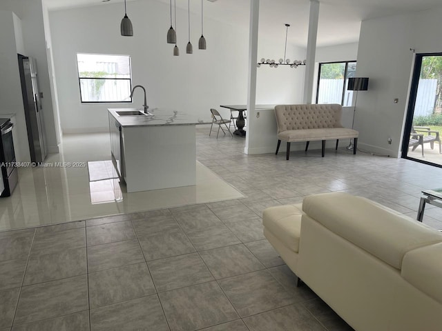 living room with sink and tile patterned floors