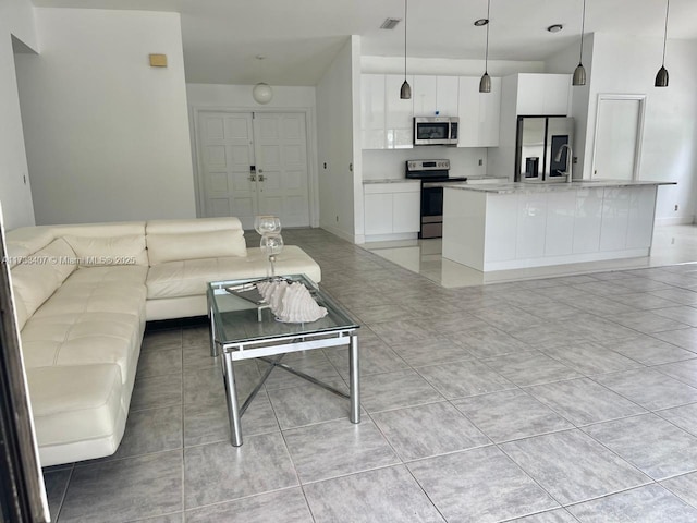 living room with light tile patterned floors