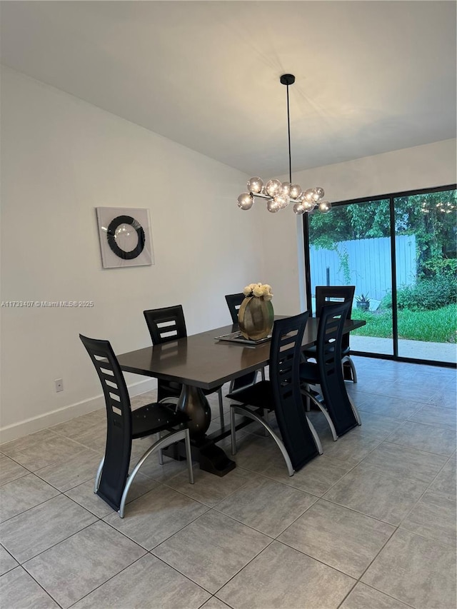 dining room featuring light tile patterned floors and a chandelier