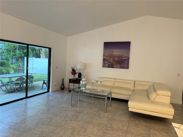 living room featuring vaulted ceiling