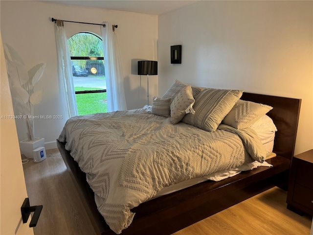 bedroom with hardwood / wood-style floors