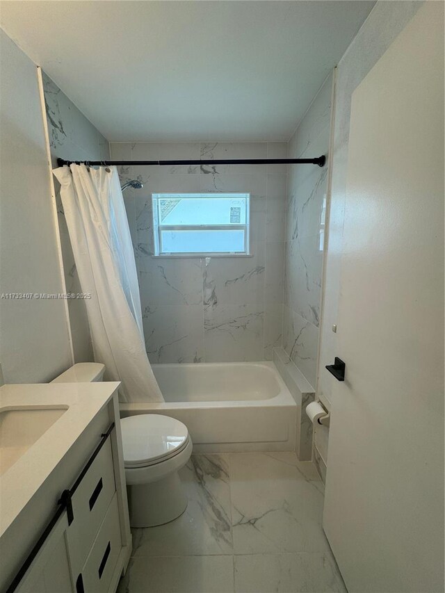 full bathroom with vanity, shower / bath combo, and toilet