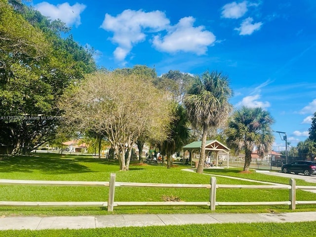 view of property's community with a gazebo and a lawn