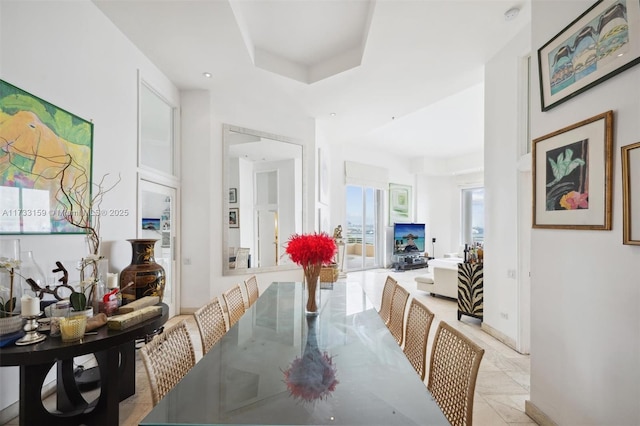 dining area featuring a tray ceiling