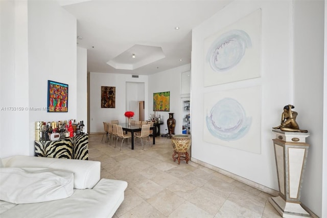 entrance foyer featuring a raised ceiling