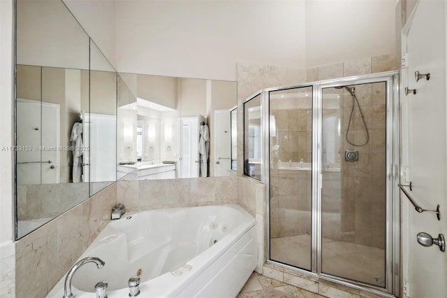 bathroom featuring separate shower and tub