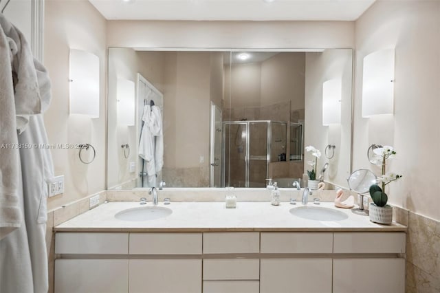 bathroom featuring an enclosed shower and vanity