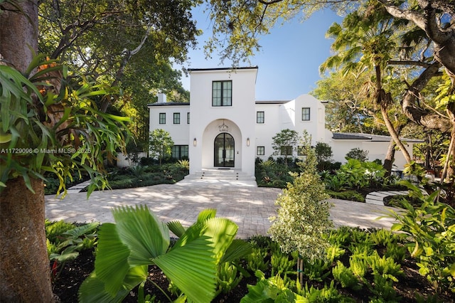 mediterranean / spanish house with stucco siding