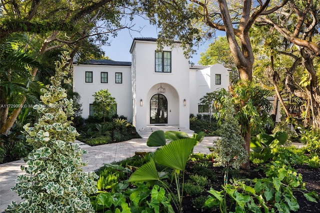 mediterranean / spanish house featuring stucco siding