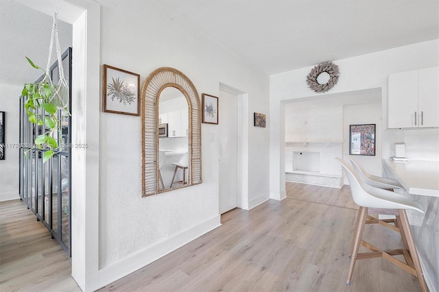 hallway featuring light wood-type flooring