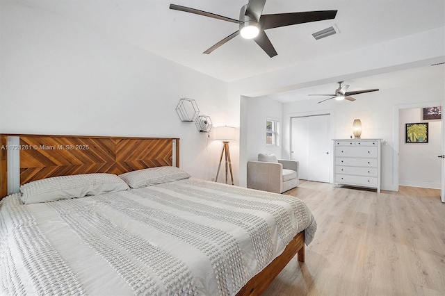 bedroom featuring a closet, ceiling fan, and light hardwood / wood-style flooring