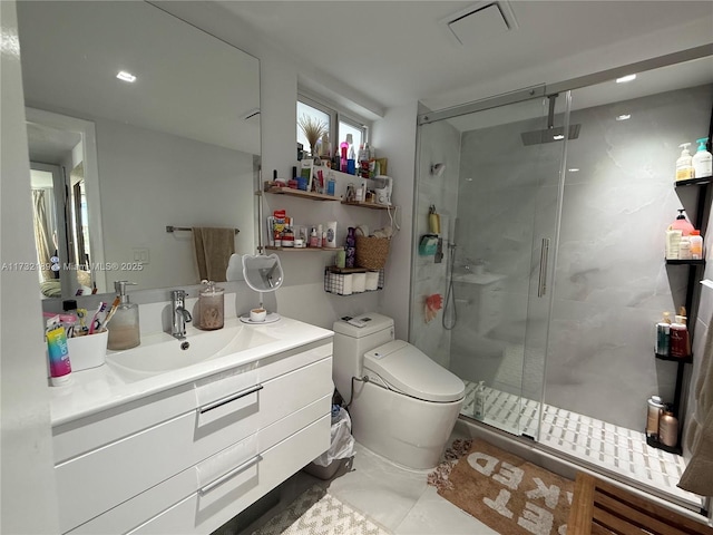 bathroom featuring a shower with door, vanity, tile patterned floors, and toilet