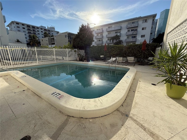 view of swimming pool with a patio area