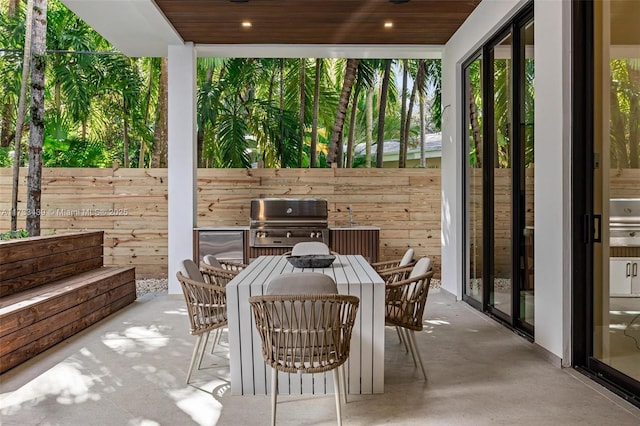 view of patio / terrace featuring grilling area and an outdoor kitchen