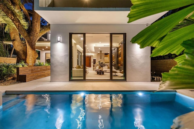 view of swimming pool with a patio area