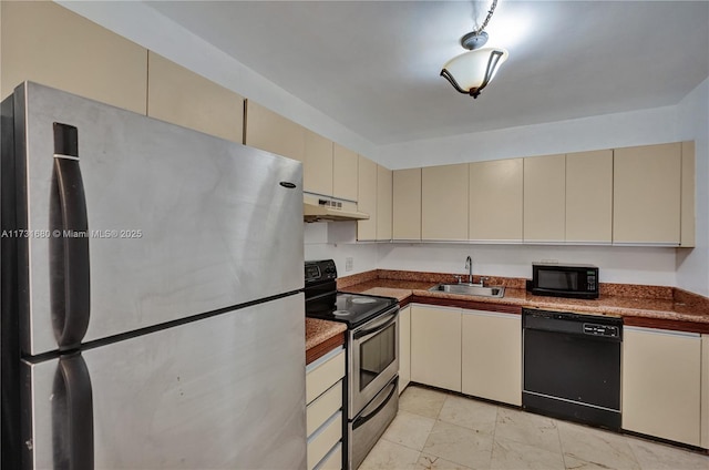 kitchen featuring sink, cream cabinets, and black appliances