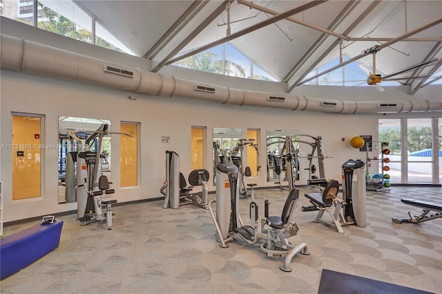 workout area with high vaulted ceiling