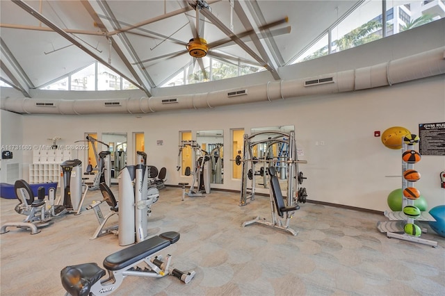 gym featuring a wealth of natural light and high vaulted ceiling