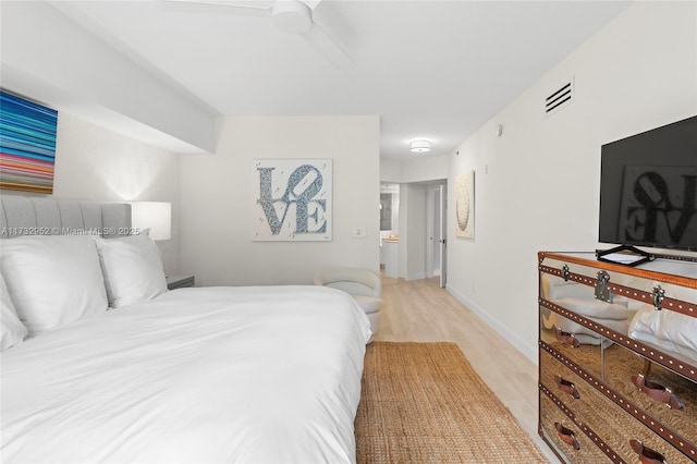 bedroom with ceiling fan and light hardwood / wood-style floors