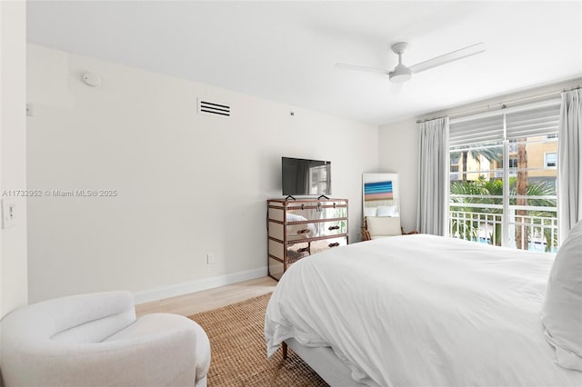 bedroom featuring light wood-type flooring, access to exterior, and ceiling fan