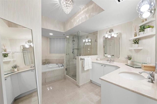 bathroom with vanity and independent shower and bath