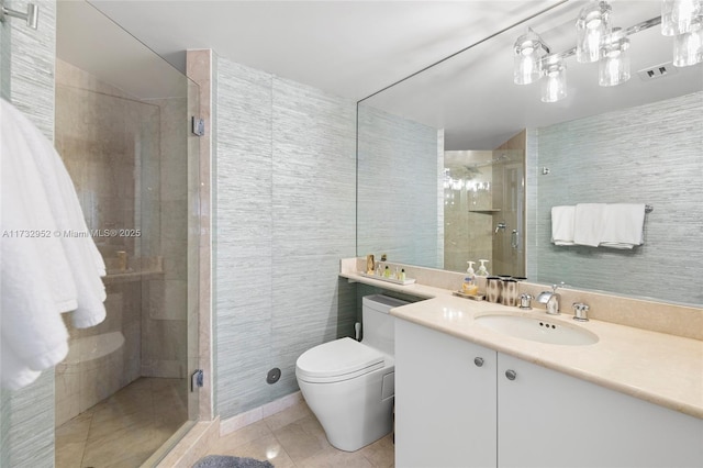 bathroom with an enclosed shower, vanity, tile patterned floors, and toilet