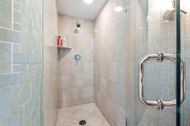 bathroom with a shower with shower door