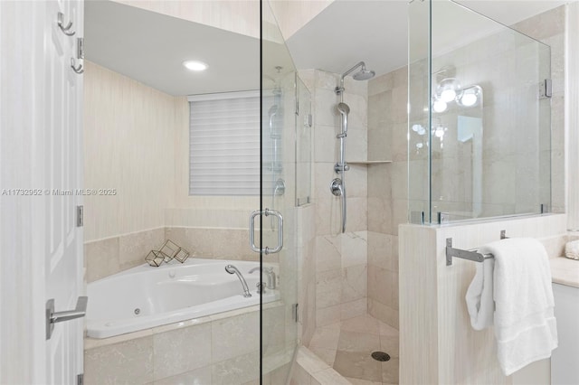 bathroom with shower with separate bathtub