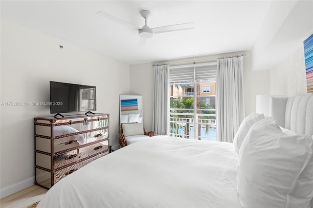 bedroom featuring access to outside, ceiling fan, and light wood-type flooring