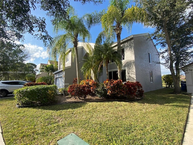 view of side of home with a lawn