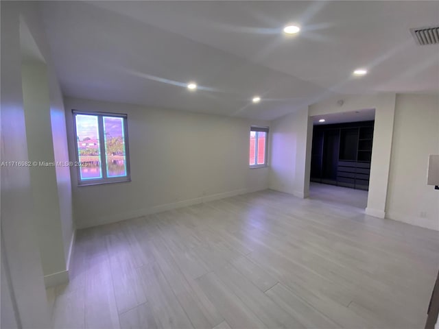 unfurnished room featuring light hardwood / wood-style floors