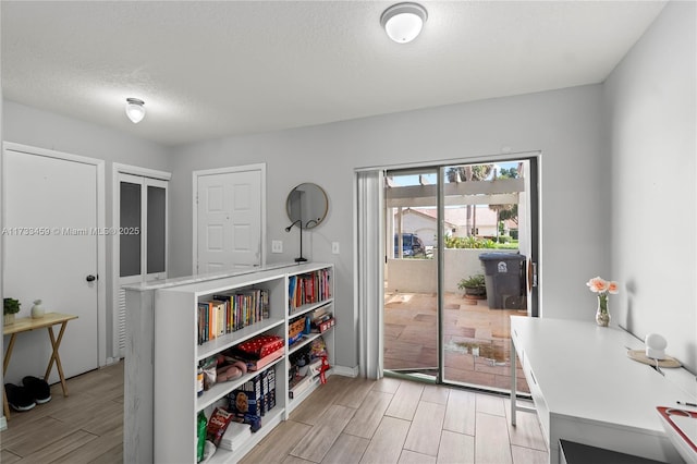 interior space with a textured ceiling