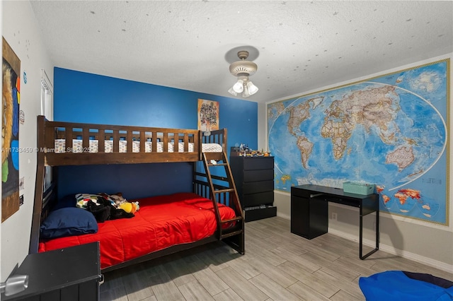 bedroom featuring a textured ceiling