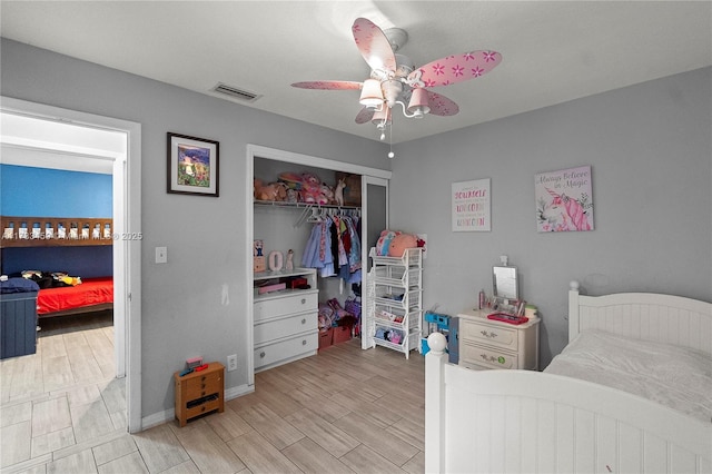 bedroom featuring ceiling fan and a closet