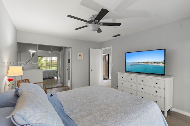 bedroom with ceiling fan and light hardwood / wood-style floors